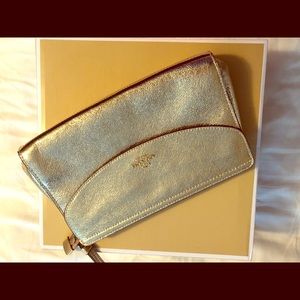 Coach  gold clutch.   New with tags
